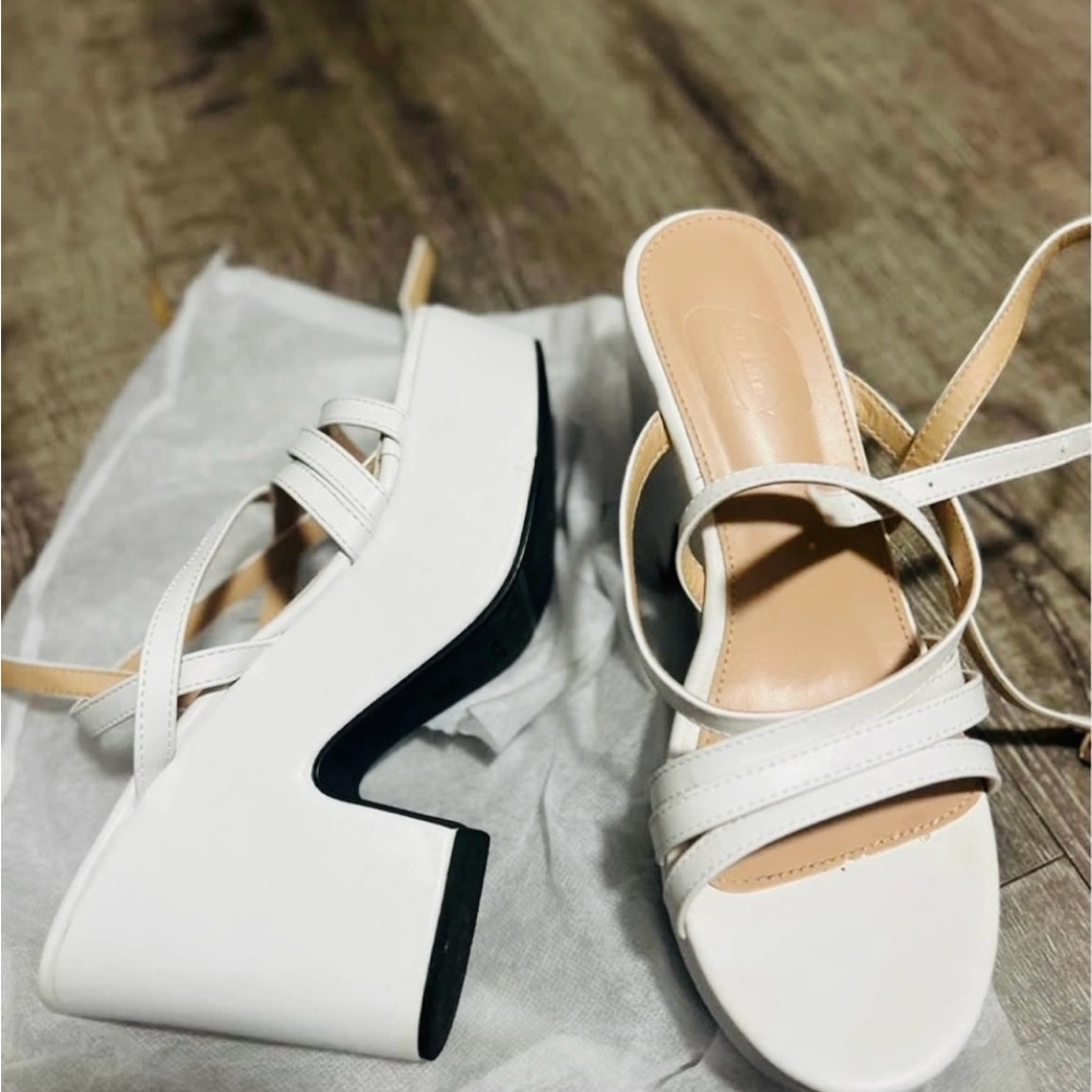 White platform chucky heel sandals.